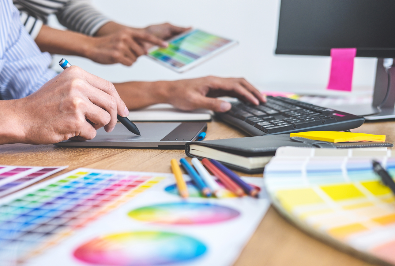 Marketing team reviewing design materials